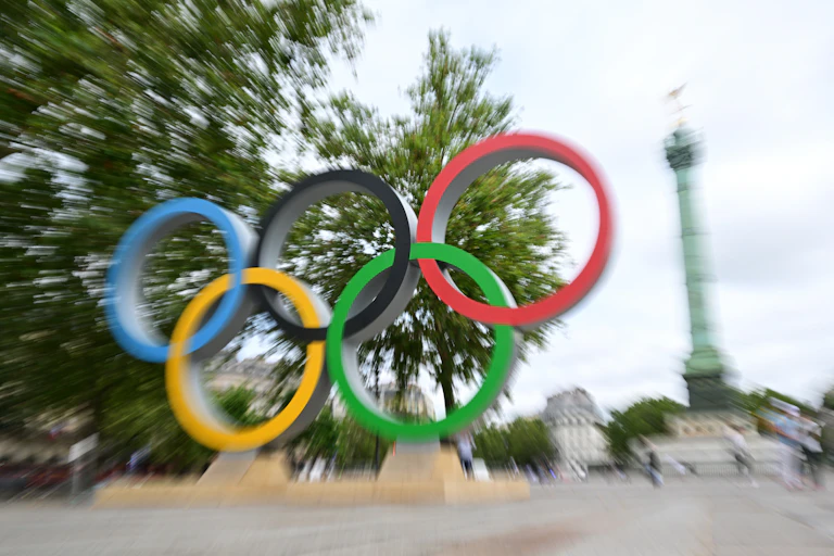 Blurred photo of Olympic rings sculpture in Paris