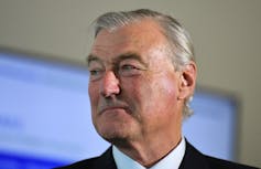 Headshot of a grey haired man