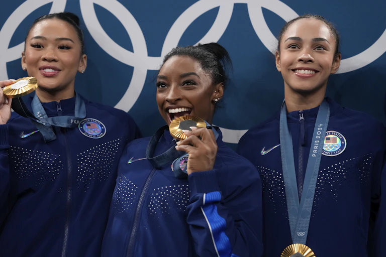 Three young women with medals