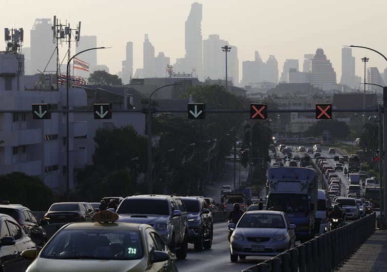 cars against city skyline