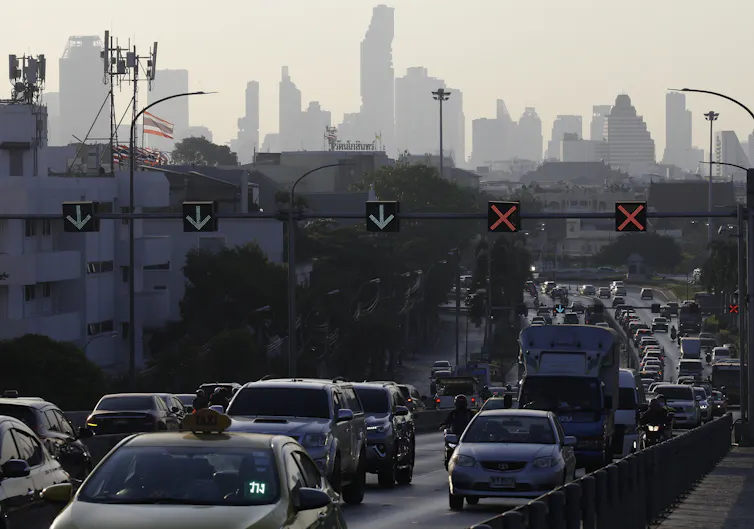 cars against city skyline