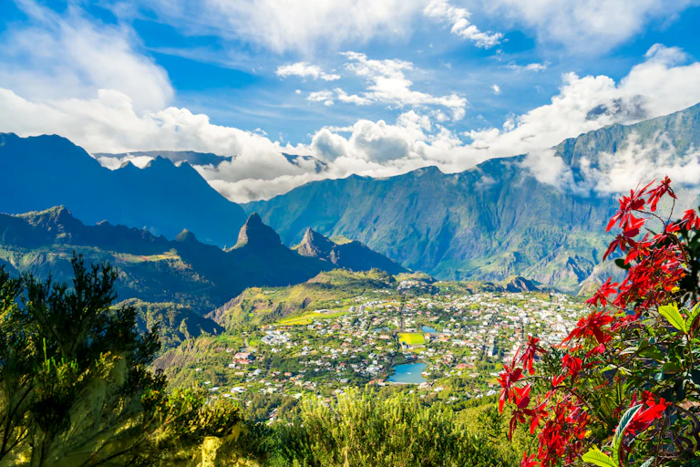 A photograph that looks like a postcard showing a mountainous landscape around a small town