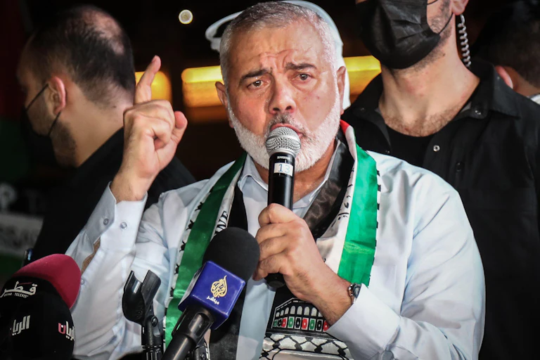 Ismail Haniyeh speaking into a microphone.
