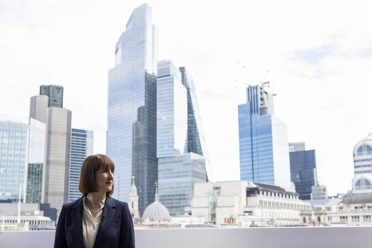 Rachel Reeves standing in front of London's skyline.