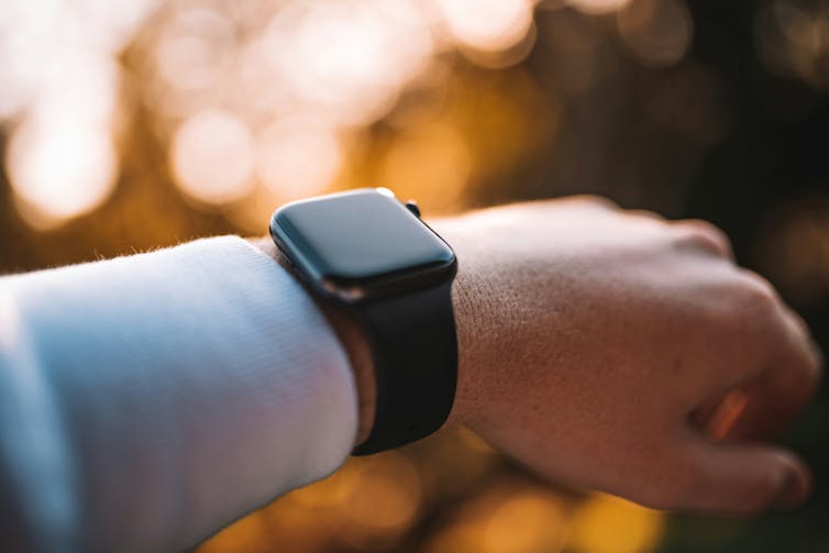 A smartwatch on a man's wrist.
