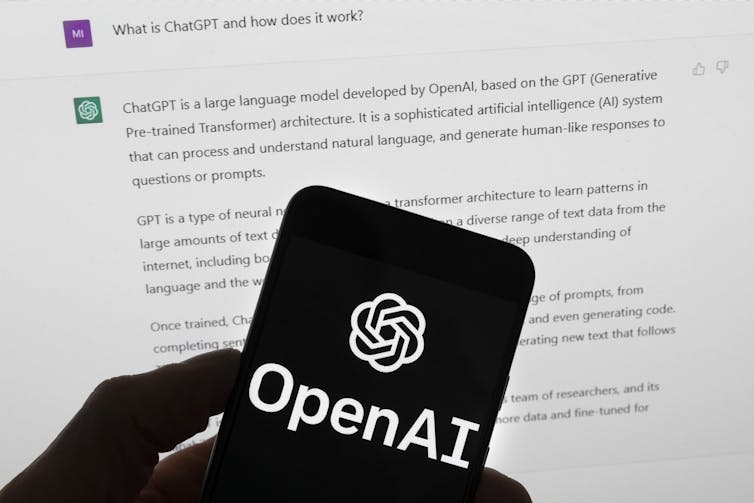 OpenAI logo on black phone screen