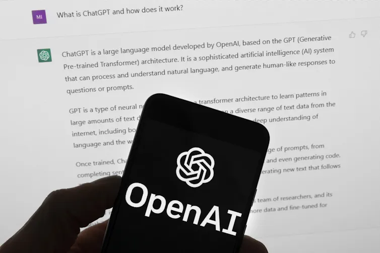 OpenAI logo on black phone screen