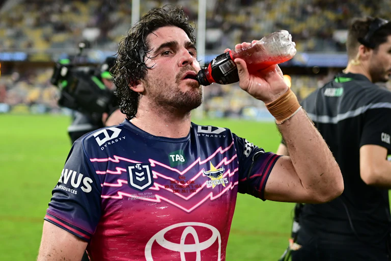 Jake Granville of the Cowboys consumes a sports drink