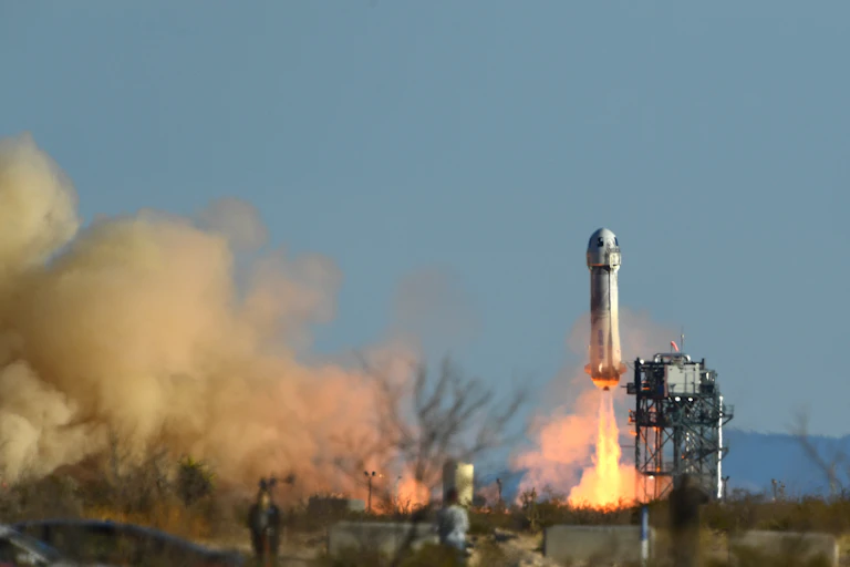 A rocket launches off at a space station