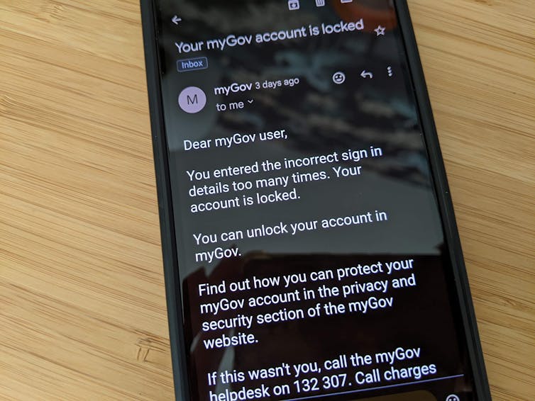 A phone screen showing an email from myGov.