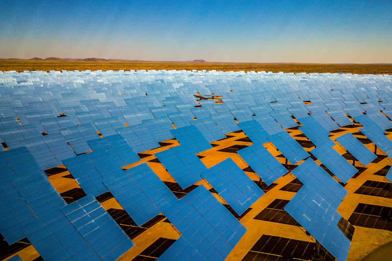 A giant array of solar panels spread out across the desert in South Africa's Northern Cape