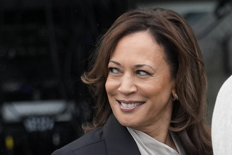 A brown-haired woman looking off to her right.