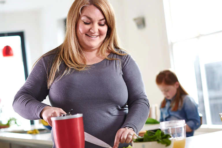 Mother making a healthy smoothie
