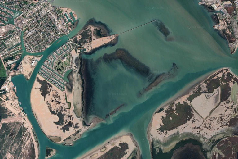 A satellite view of a cut-through to a port.