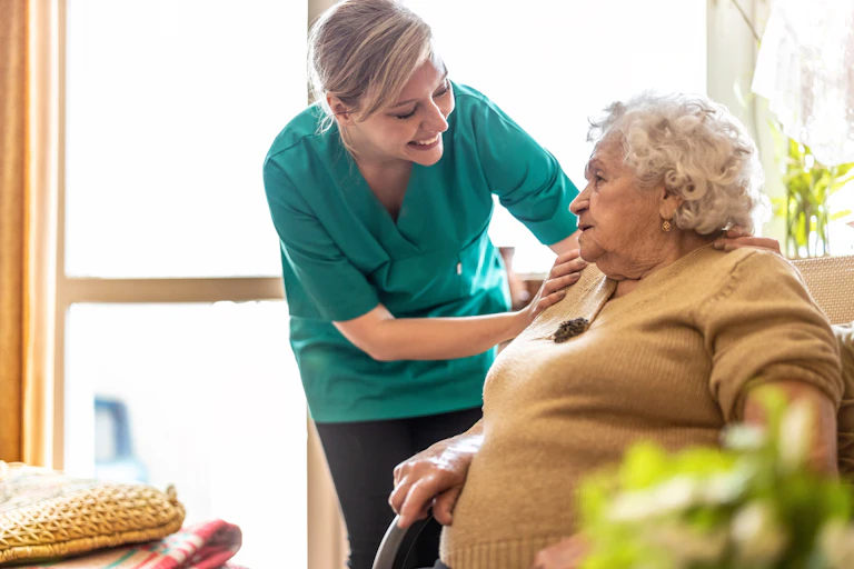 Aged care worker helps resident