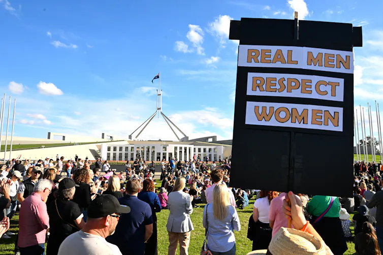 A sign that says real men respect women
