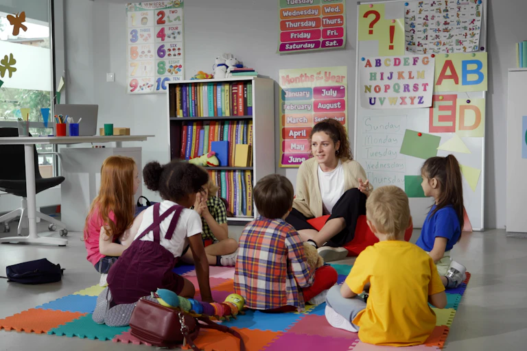 A group of preschool students and their teacher in a classroom