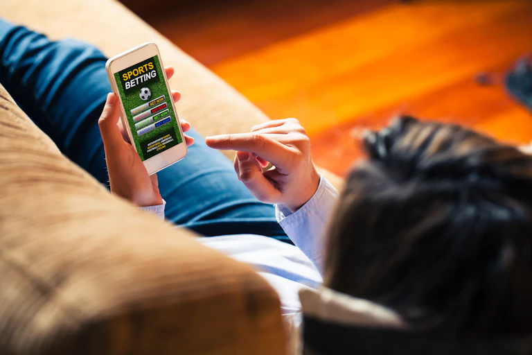 woman on couch with phone