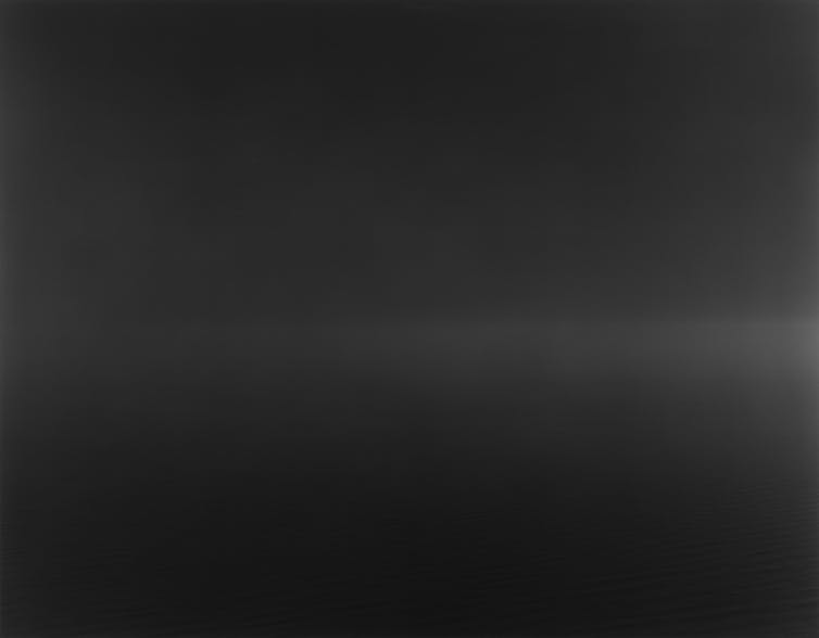 A nearly completely black image.