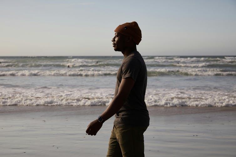 Man walks on a beach