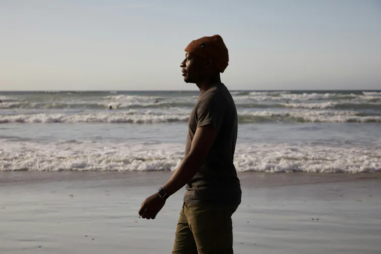 Man walks on a beach