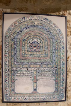 A document with once-bright colors that have now faded, and a tree-like shape in the middle.