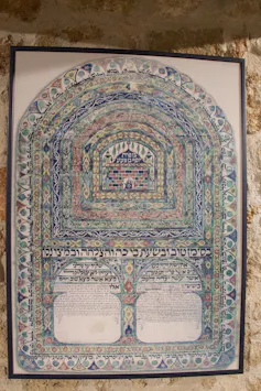 A document with once-bright colors that have now faded, and a tree-like shape in the middle.
