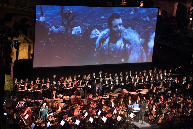 An orchestra plays in front of Gladiator