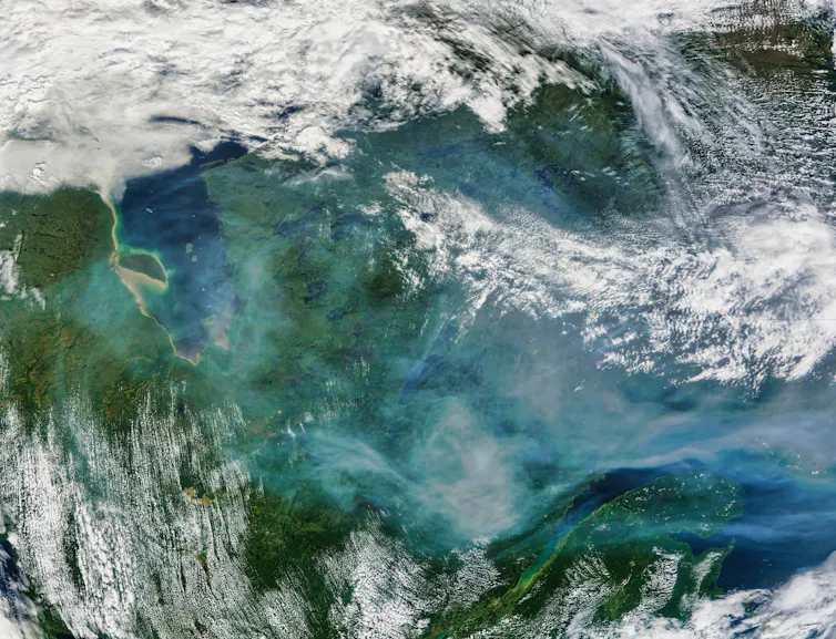 A satellite image showing smoke travelling in the atmosphere.