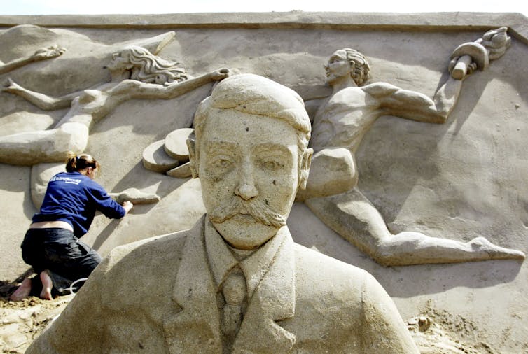 A sand sculptures is prepared for the Paris Olympics.