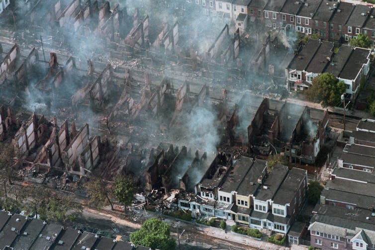 A view from above shows smoke arising from about 60 homes destroyed by Philadelphia police.