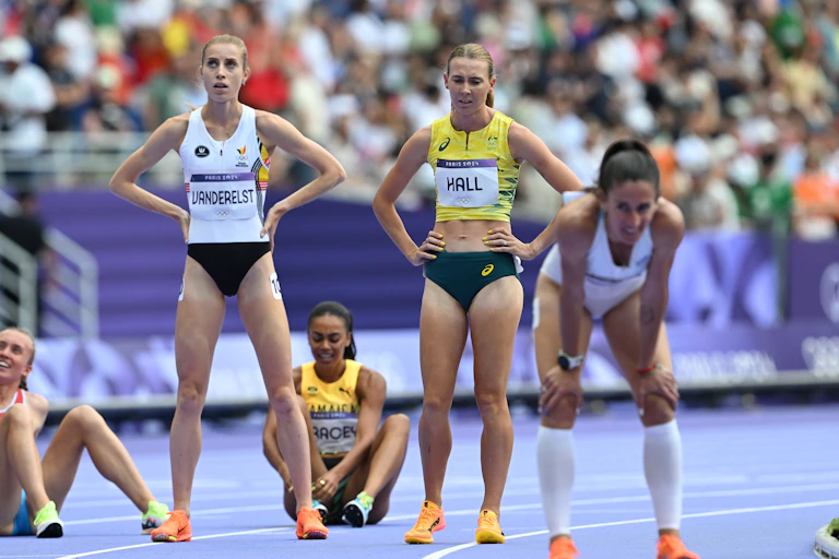 Competitors try to catch their breath after the women's 1500m repechage in Paris