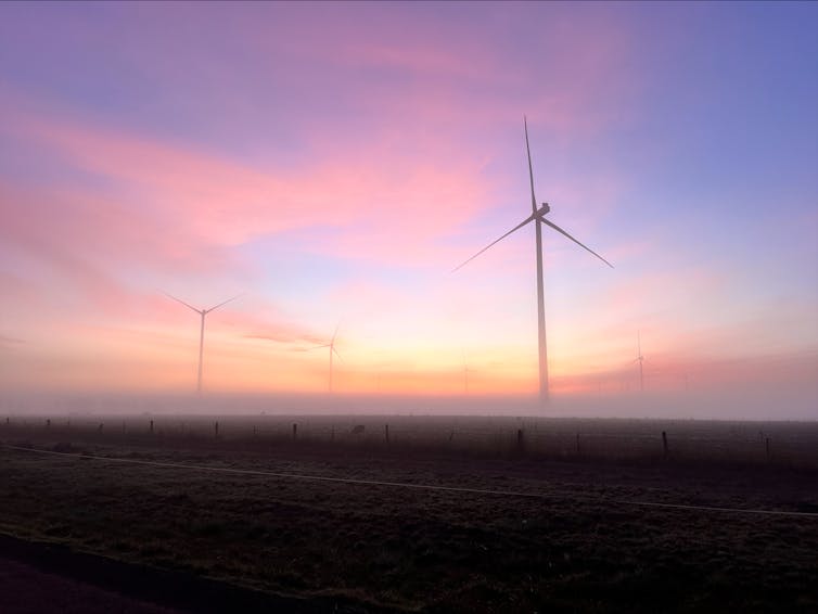 wind turbines in mist