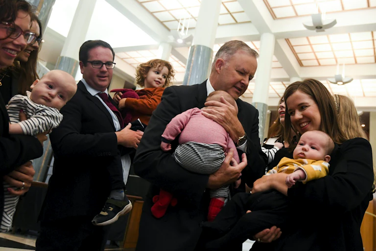 Photo of Prime Minister Albanese holding children