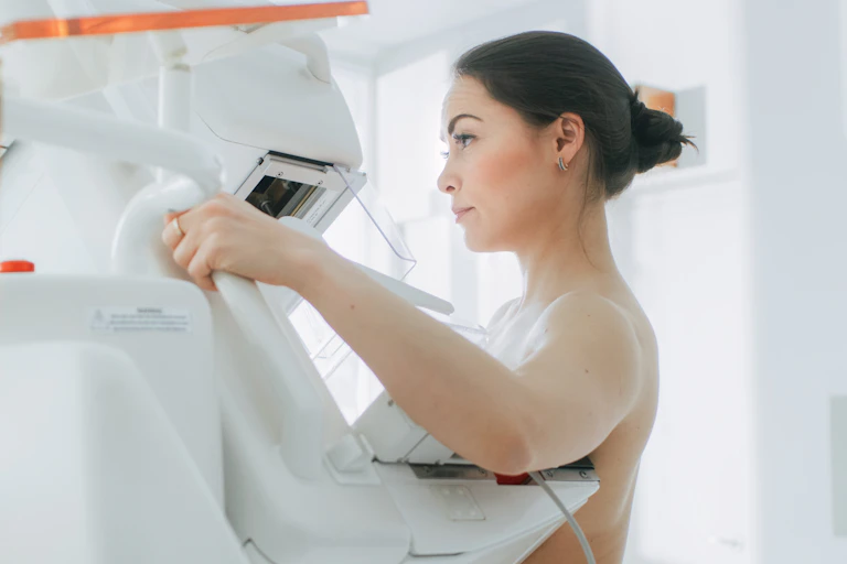 A woman has a mammogram.