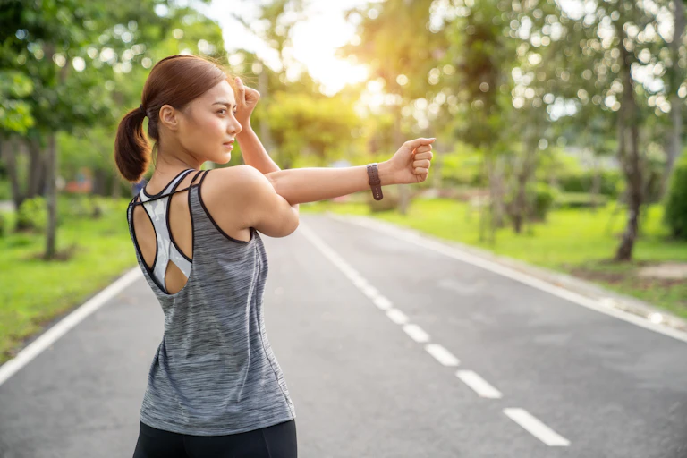 Woman using fitness tracker