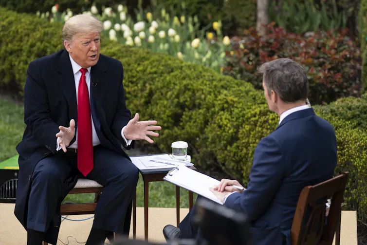 Donald Trump filming a Fox News interview during the COVID pandemic.