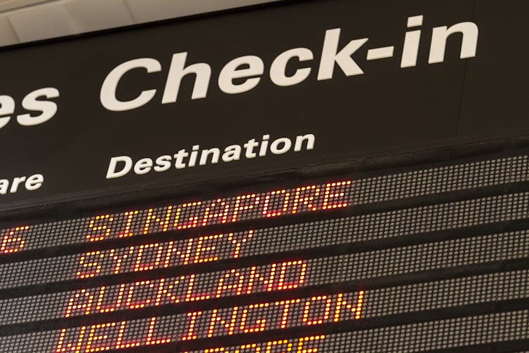A check-in board in an aiport