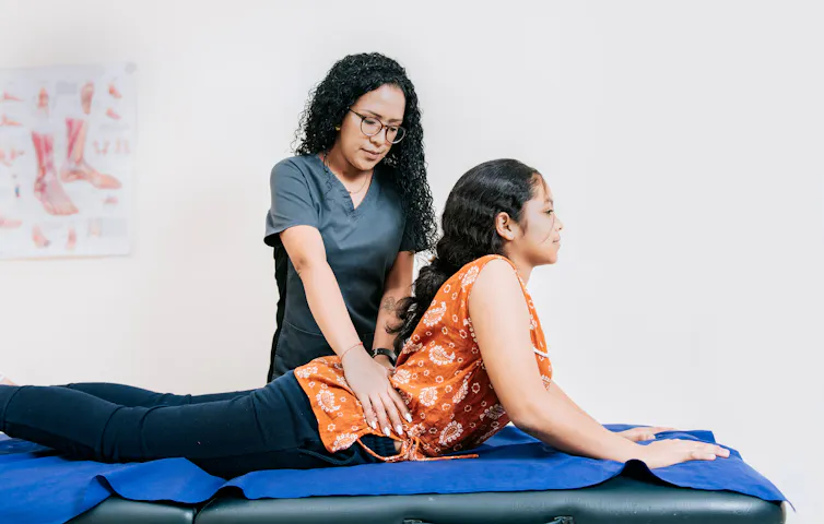 Physio assesses patient