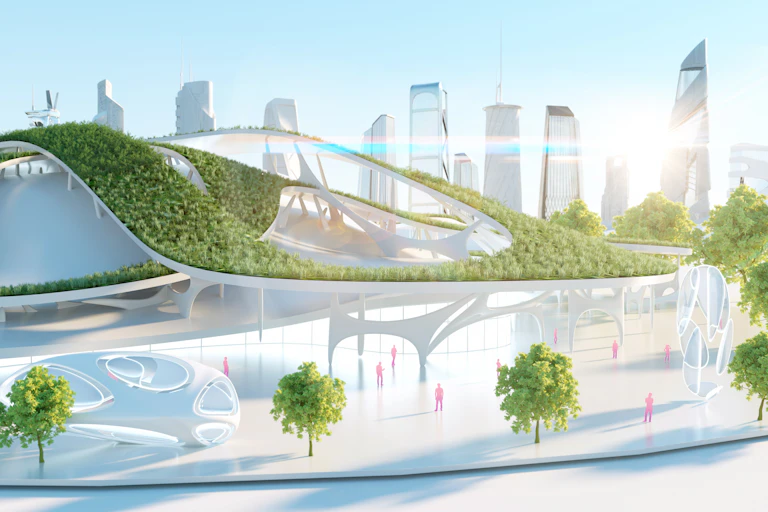 a futuristic white city with plenty of green shrubs and trees