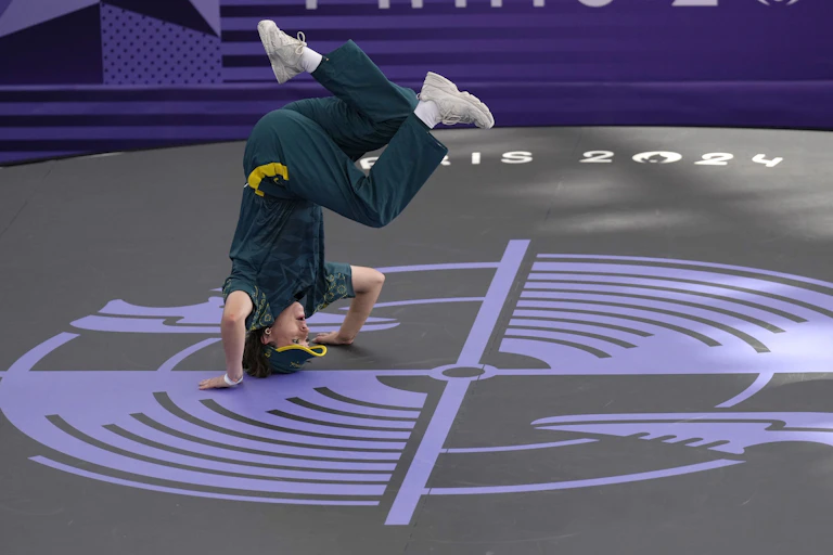 Raygun does a headstand during the Olympic breaking competition