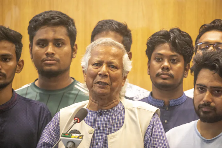 Muhammad Yunus, surrounded by protest student leaders.