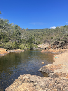 A natural waterway surrounded by bushland