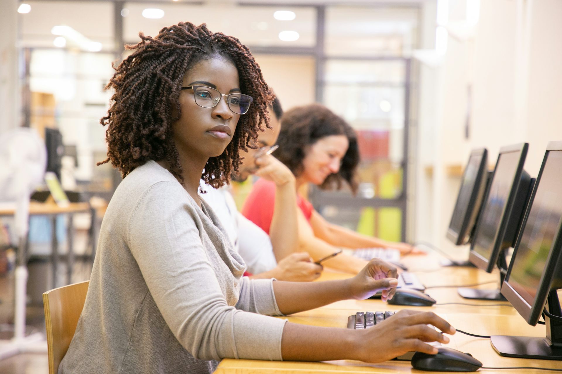 Student at desktop computer in classroom