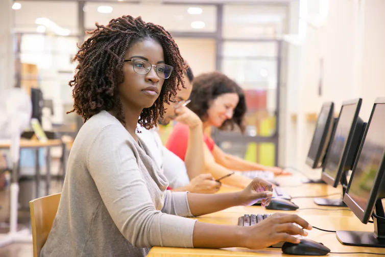 Student at desktop computer in classroom