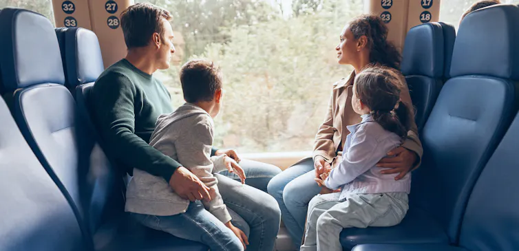 A family enjoy a train ride