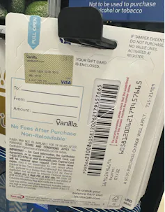 The back of a reloadable gift card with a partially covered barcode