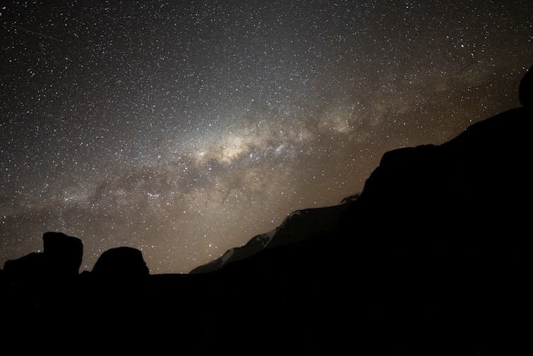 The Milky Way above limestone formations in Castle Hill, New Zealand