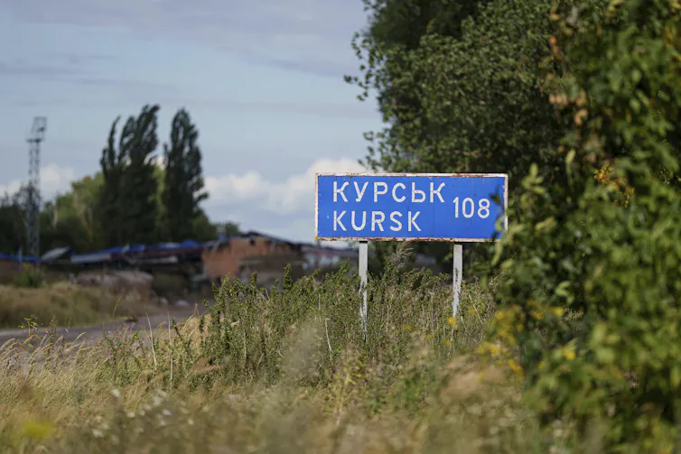 A plate with sign 'Kursk 108 km' is seen on the Russian-Ukrainian border.