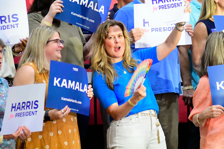 Kamala Harris supporters with posters.